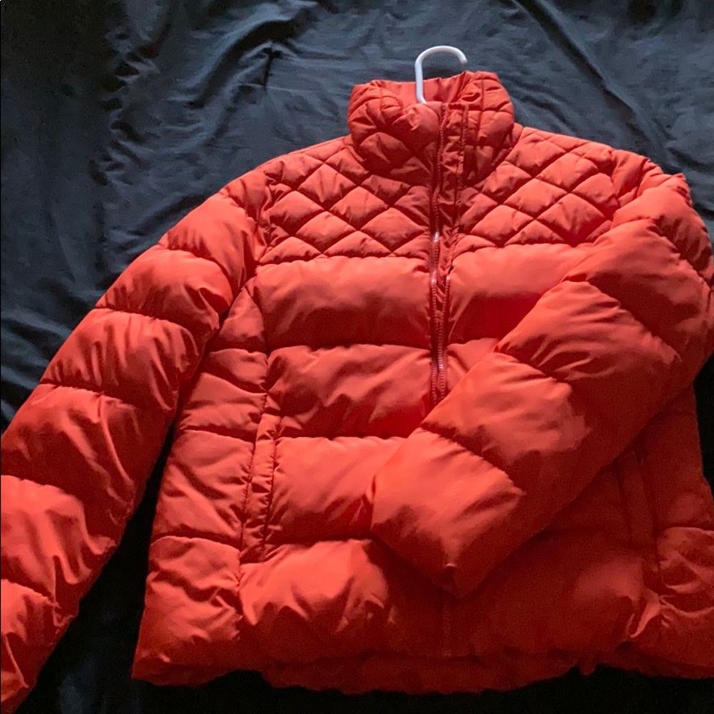 Bright orange puffer jacket